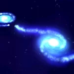 سیاهچاله‌ای عظیم که در مرکز کهکشانی نزدیک و غول‌پیکر پنهان شده‌ بود، در یک برخورد تماشایی از کهکشانی کوچک‌تر تغذیه می‌کند.